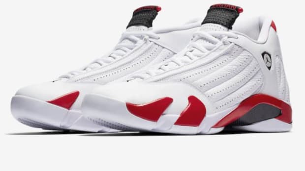 View of white, red, and black Air Jordan shoes.